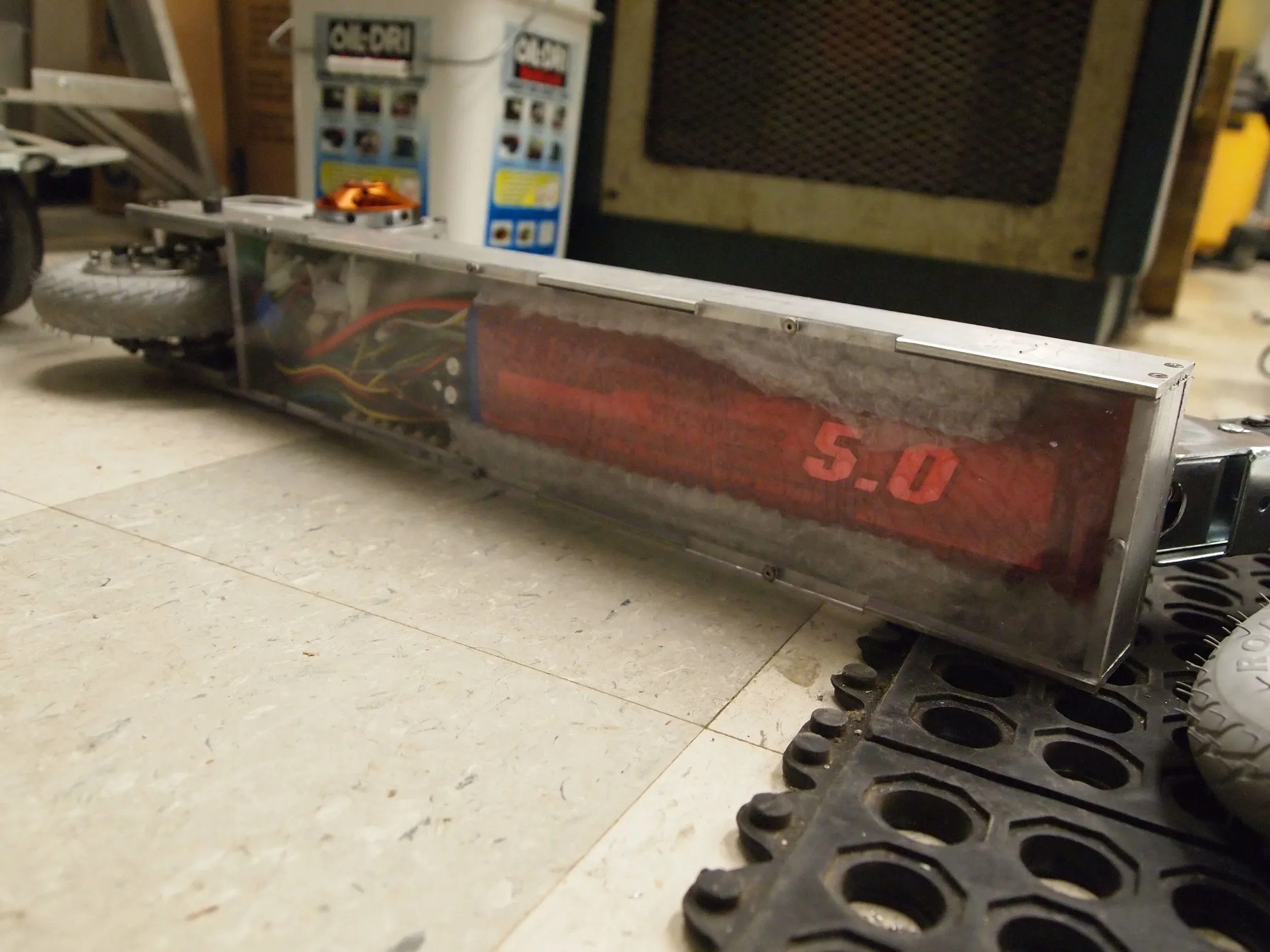 The scooter ran off a giant 6S LiPo battery. The electronics were protected with a laser-cut sheet of acrylic.