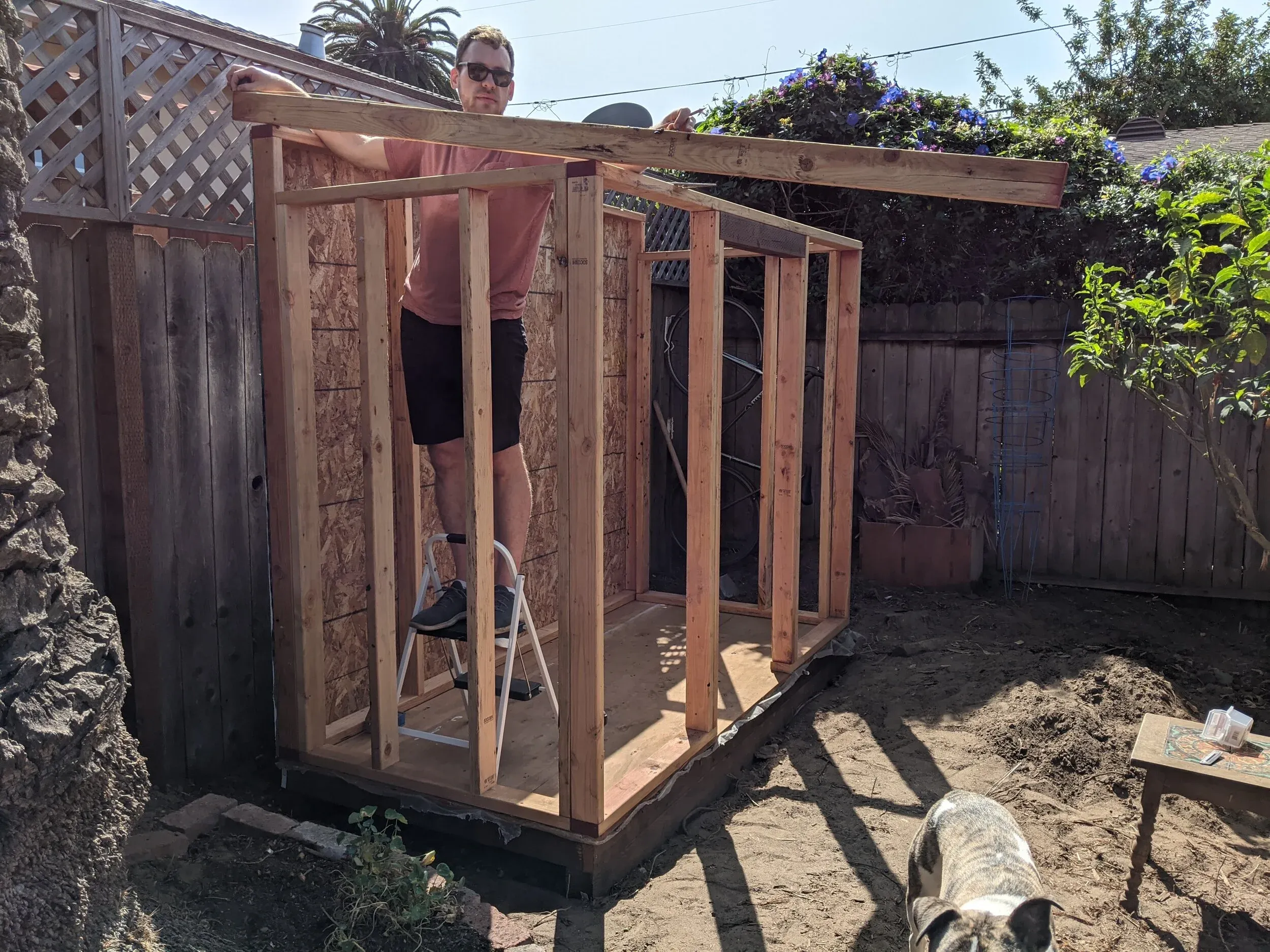 Walls are up! Here I’m marking out the birds-mouth cut in the first roof rafter.