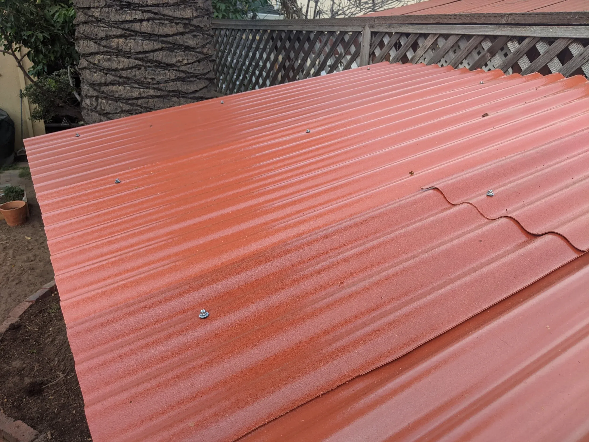 The fiberglass roof panels were easy to install with gasket screws.