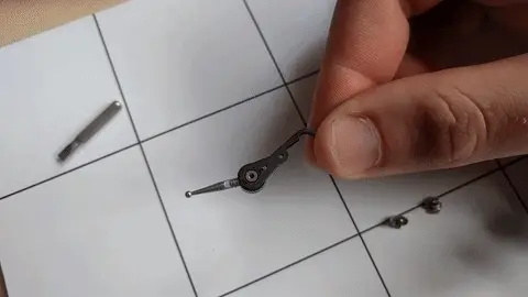 Main pivot component with small bearing balls visible